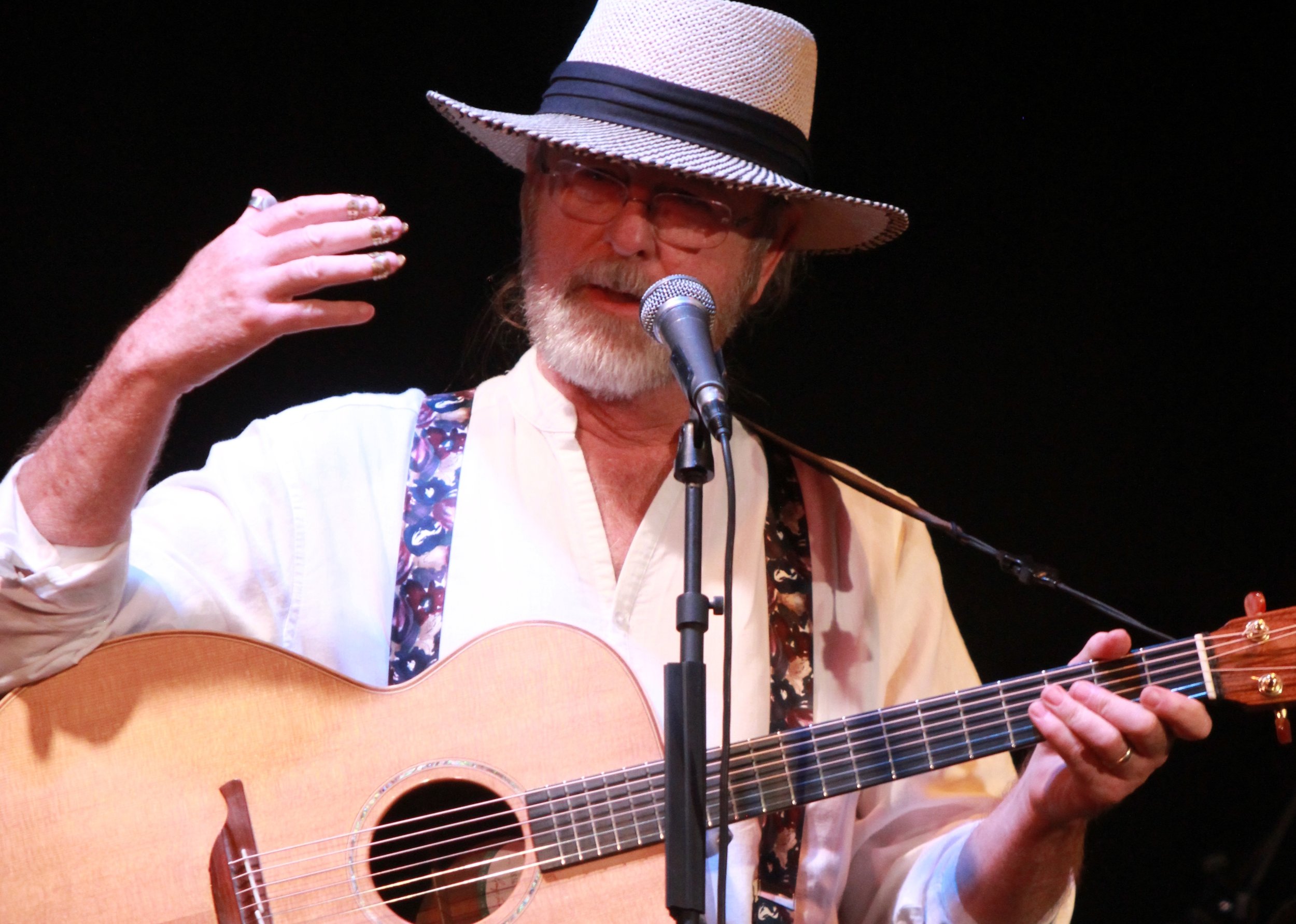 Walter grew up in Fargo, ND and spent his teenage summers working on the family farm. In the evenings his uncle taught him to play guitar and his grandmother would play songs from the Methodist Hymnal on the piano. He learned to fingerpick when the great folk music scare of the the 1960’s (Dave Van Ronk’s phrase) swept the nation and played bad rock ‘n roll when the British invaded. He started writing songs. One morning in January, 1968, he was driving to a college class, it was 30 degrees below zero and the heater in his Studebaker Silverhawk wasn’t working. He vowed he would never spend another winter in North Dakota. He joined the Air Force. A lot of interesting things happened after that. http://www.bigfatmoon.com/