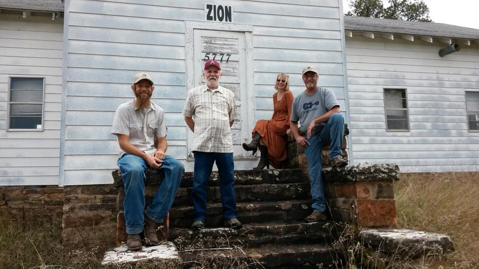 East of Zion is an acoustic, family band with deep roots in Ozark Mountain music. Pat Fultz is the lead vocalist and rhythm guitar player while her husband Mac Fultz is the lead guitarist and does vocals as well. Their nephew Nathan Miller plays mandolin and sings and cousin Jerry Hogan is on upright bass. Playing together now for over eight years, East of Zion continues an Ozark music tradition that is almost a century old.