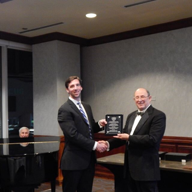 Dixon Tucker, P.E., congratulates Andrew Newbold of Hazen and Sawyer on receiving the ECHR Engineering Excellence Award for 2019.