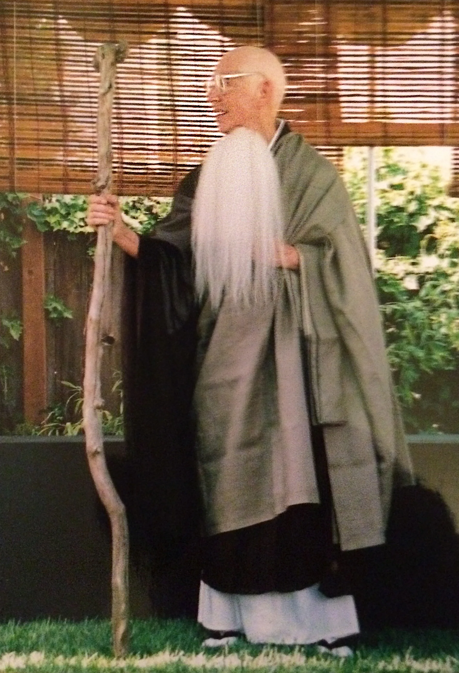 Katherine Thanas is seen with whisk and staff at the mountain seat ceremony in 2002.