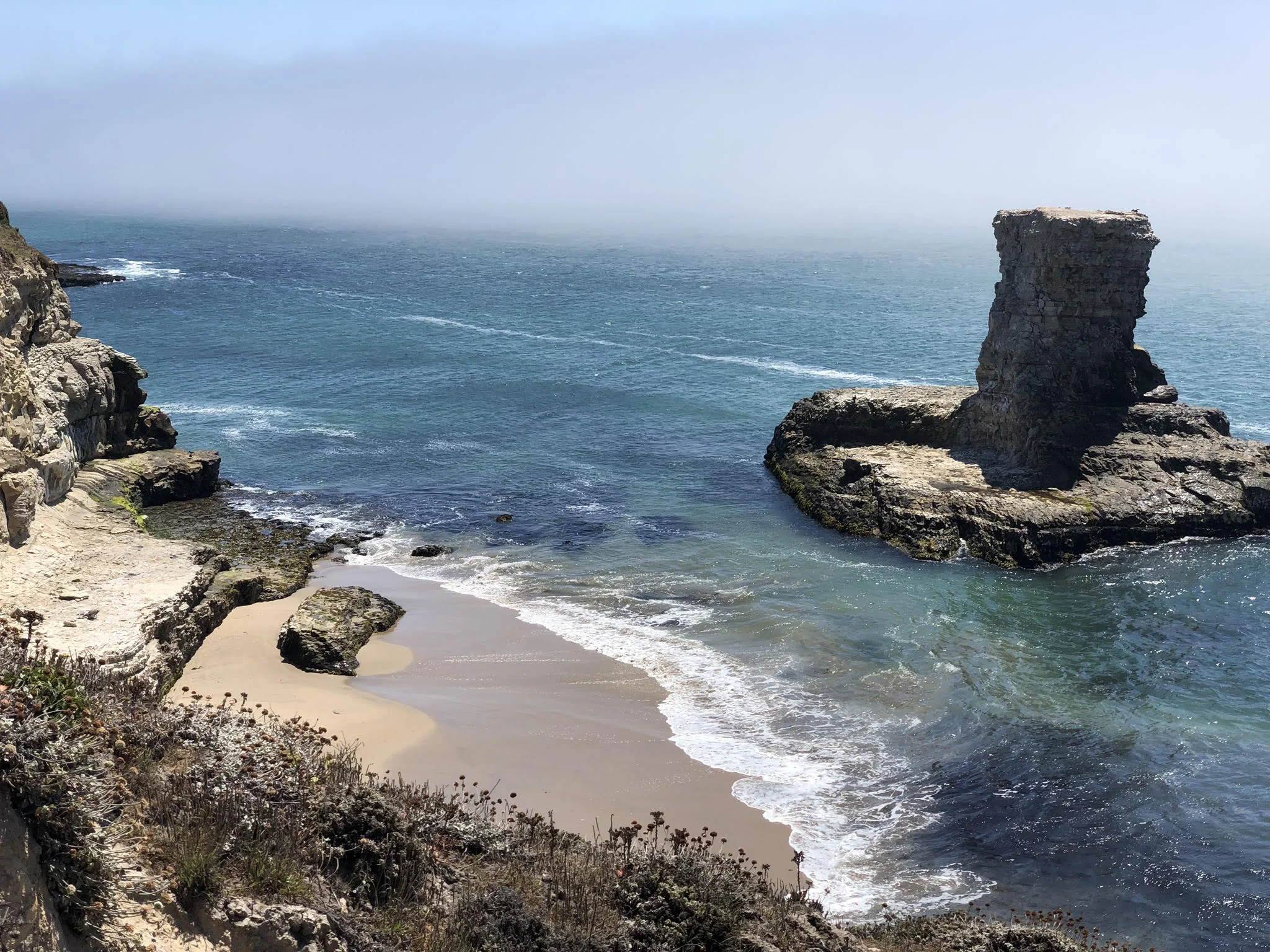 At one time this rock was part of the shore… but the wind, water, and time have separated them. So it goes sometimes.