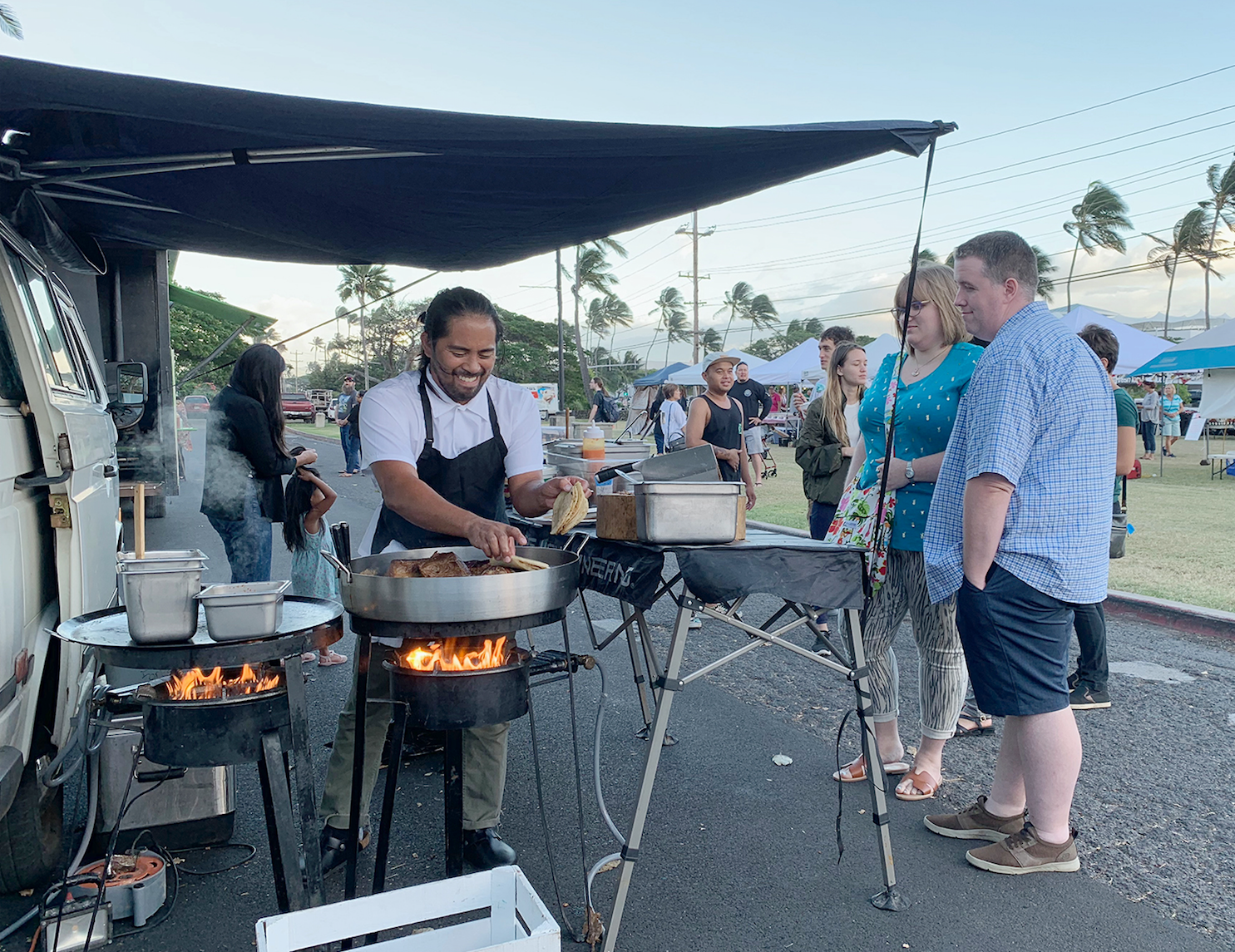 Tight Tacos owner Reggie Ballesteros prepares his Mexican dishes with Hawaiian flavors during the Maui Street Market held at the UH Maui College on Dec. 6.