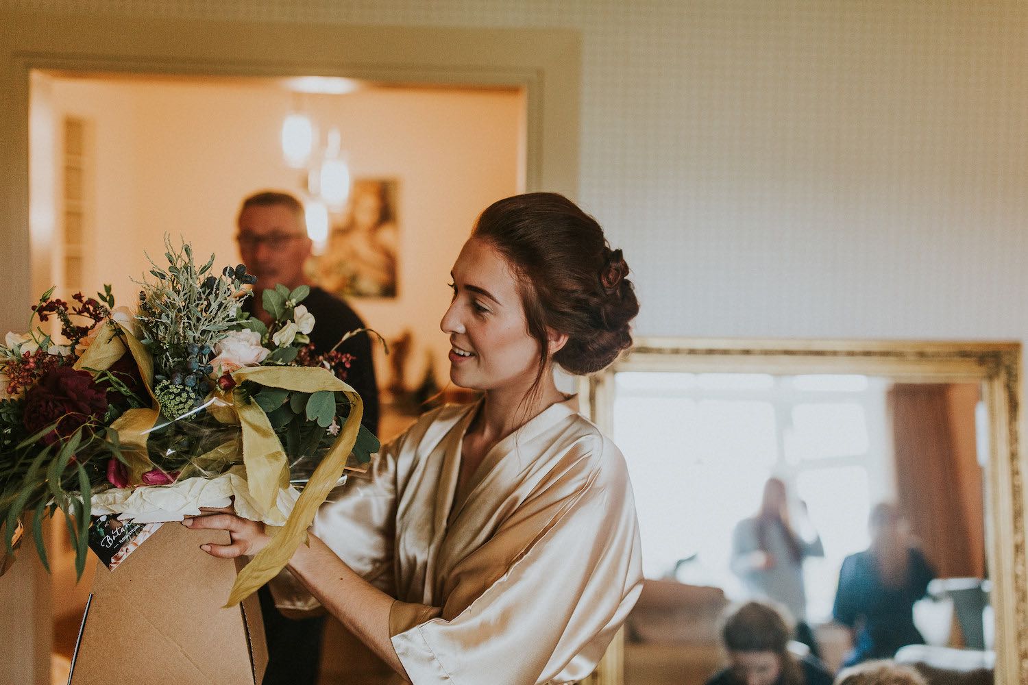 Brdie receiving flowers on morning of wedding