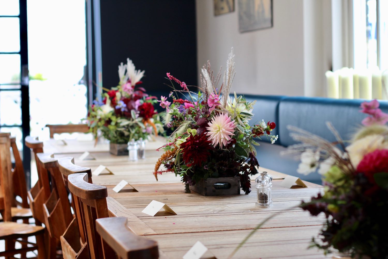 Pub wedding reception tables with autumn flowers