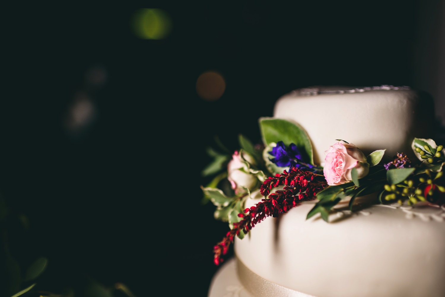 White wedding cake with trailing flowers