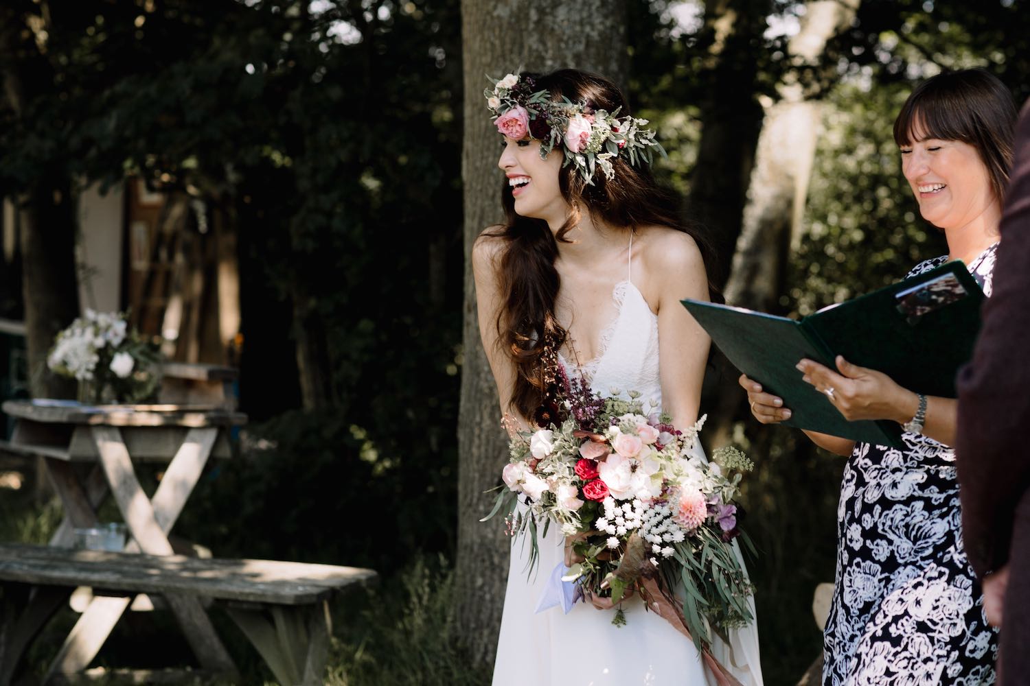 Bride and celebrant with table flowers