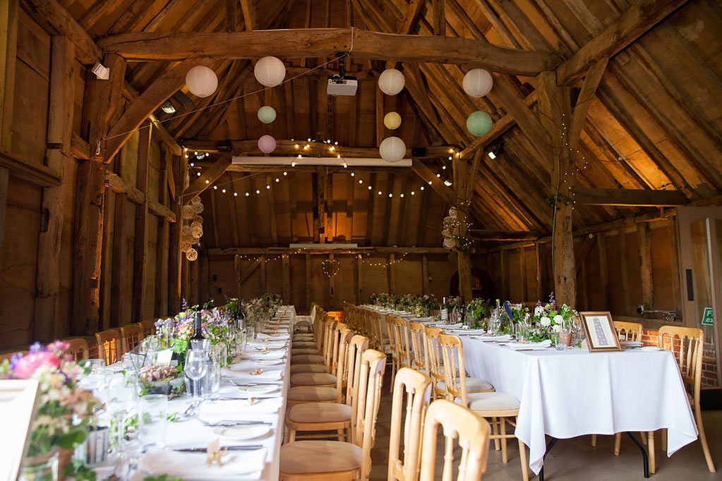 Barn wedding reception botanically styled tables