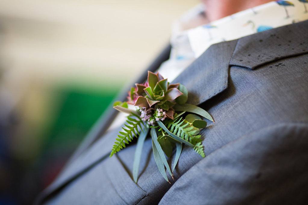 Buttonhole with ferns and wild flowers