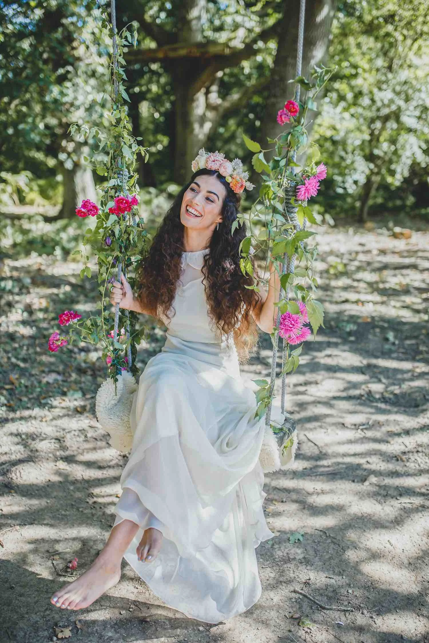 Bride on rope swing with flowers