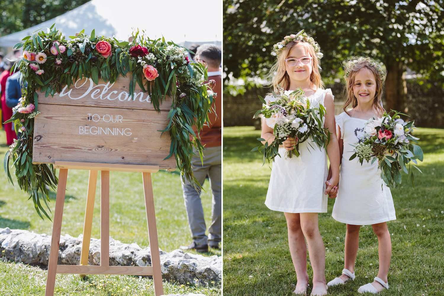 Welcome board with flowers and flower girls