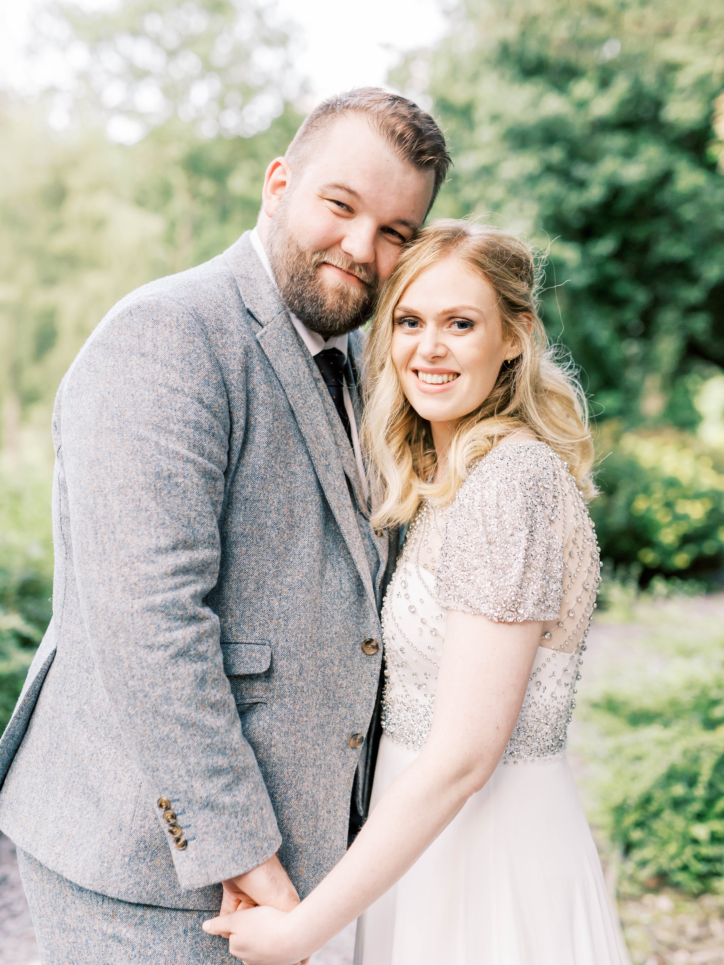 bride and groom in grounds of tyn dwr hall