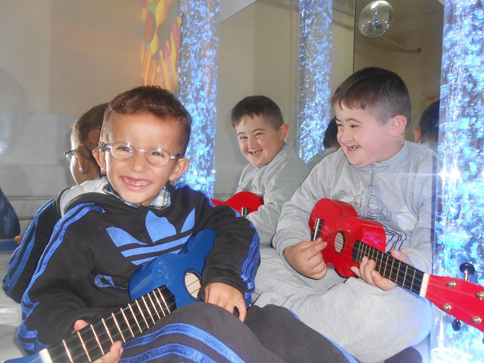 Kosovo boys with guitars.jpg