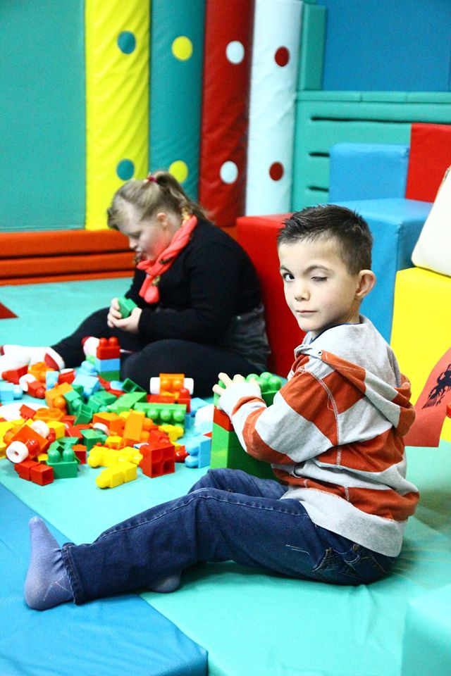 Kosovo boy with playing bricks.jpg