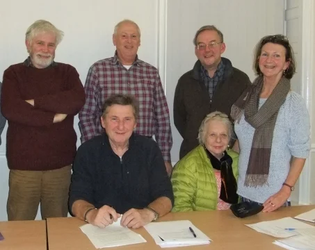 Jim Munro standing on the far left with other directors