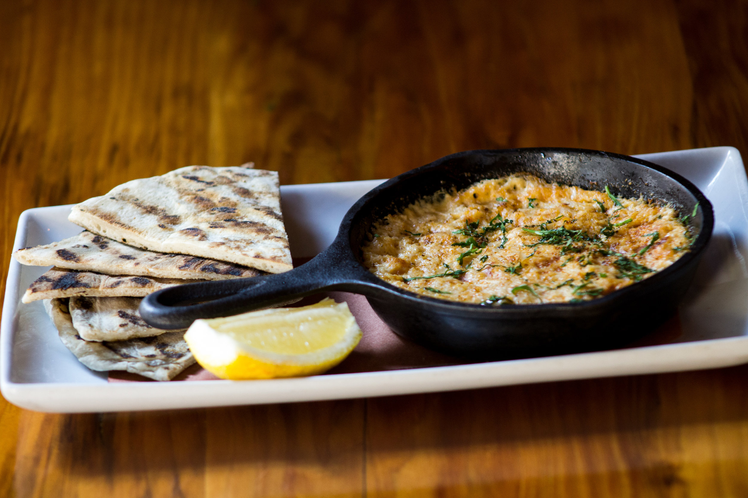 Warm Crab Dip Vermont cheddar, cream cheese, Old Bay, lemon, grilled flatbread