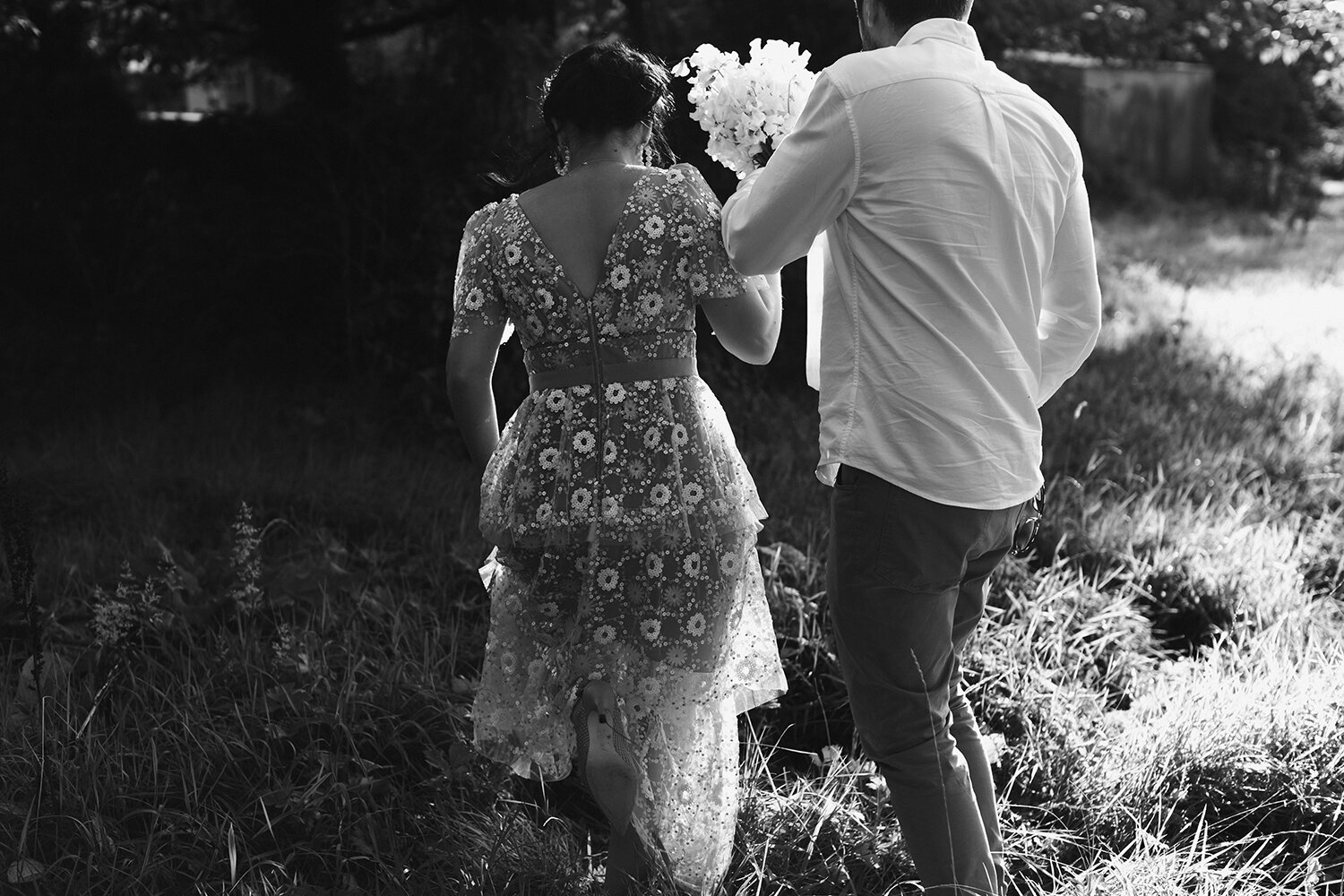 Bride and groom natural photo with white floral bouquet and white buttonhole at Limepark - floralearth wedding florist