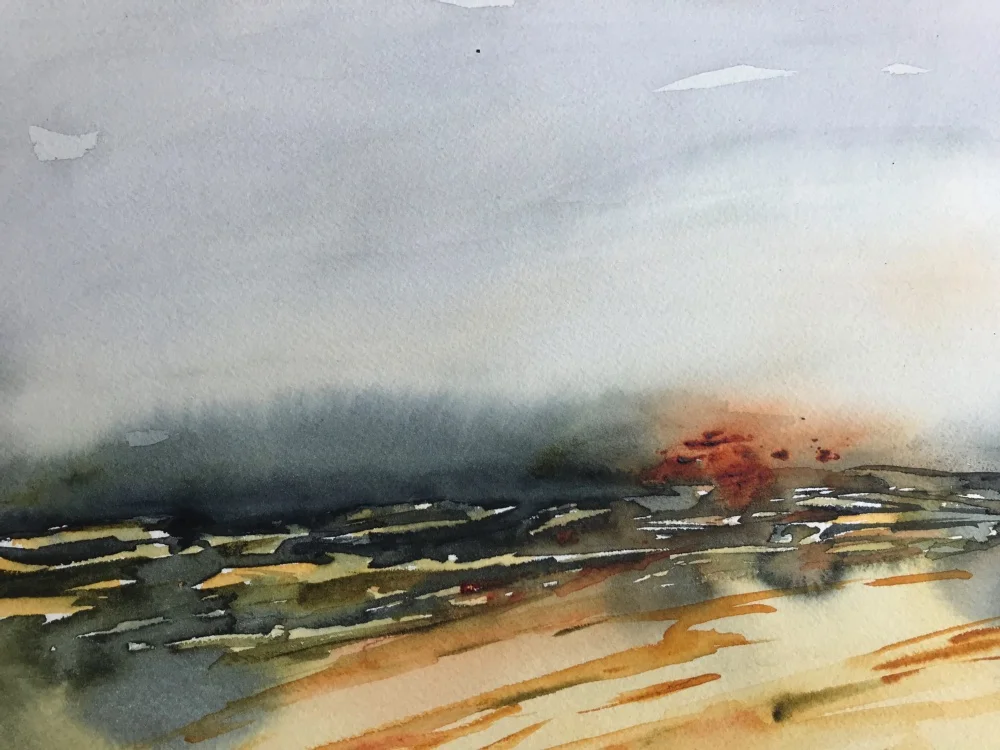 A watercolor painting of a landscape with a cloudy sky, distant mountains, and a field of grass or crops in the foreground.