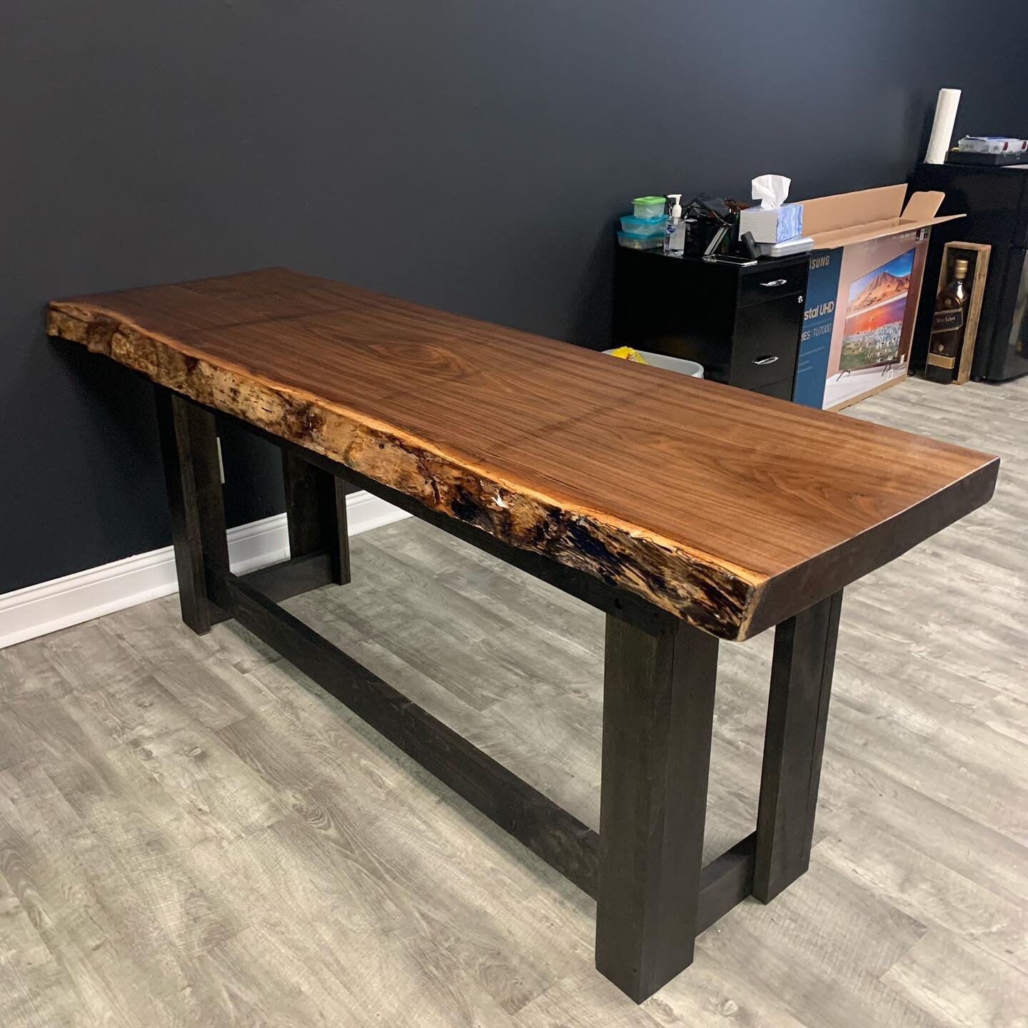 Custom walnut table for my very good friend @coniahtimm. Congrats on your own studio! If your looking for some fresh ink contact @axialstudio_ct  #cloutierconstructionanddesign #custom #walnut #liveedge #table #tattoostudio #therapysessions #ink #liv