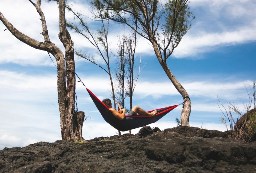 You’re fine without a bug net when you’re chilling out in a hammock during daytime. But bug nets for hammocks are all-important once night turns to day.