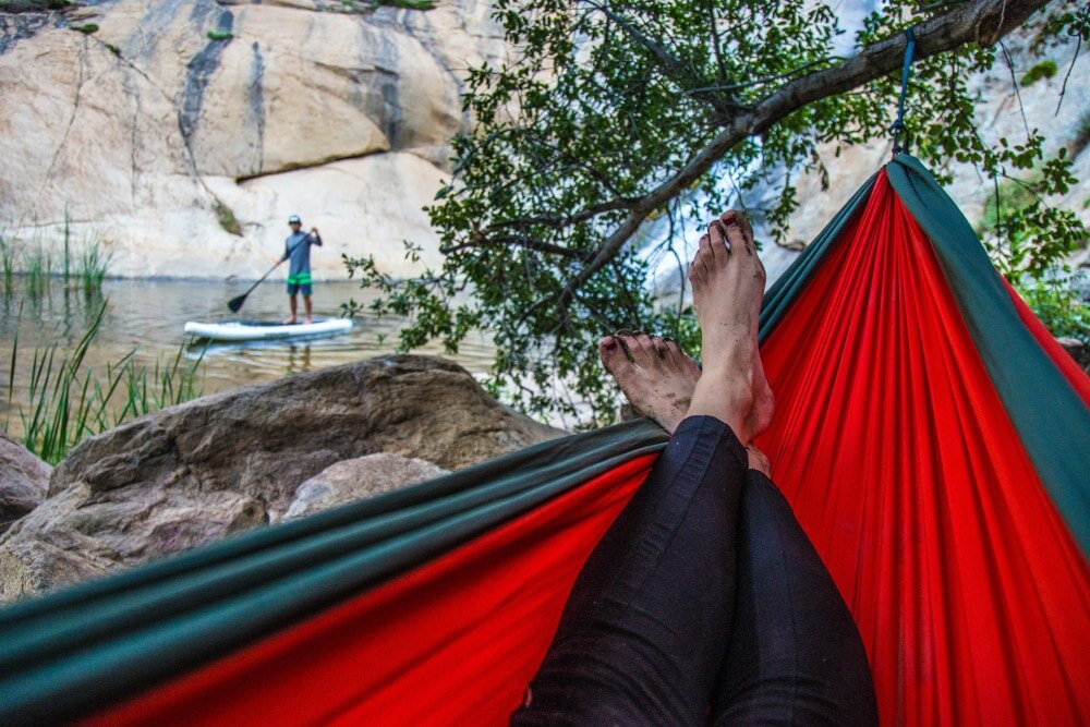 A quality rain tarp for hammock camping makes all the difference in bad weather.