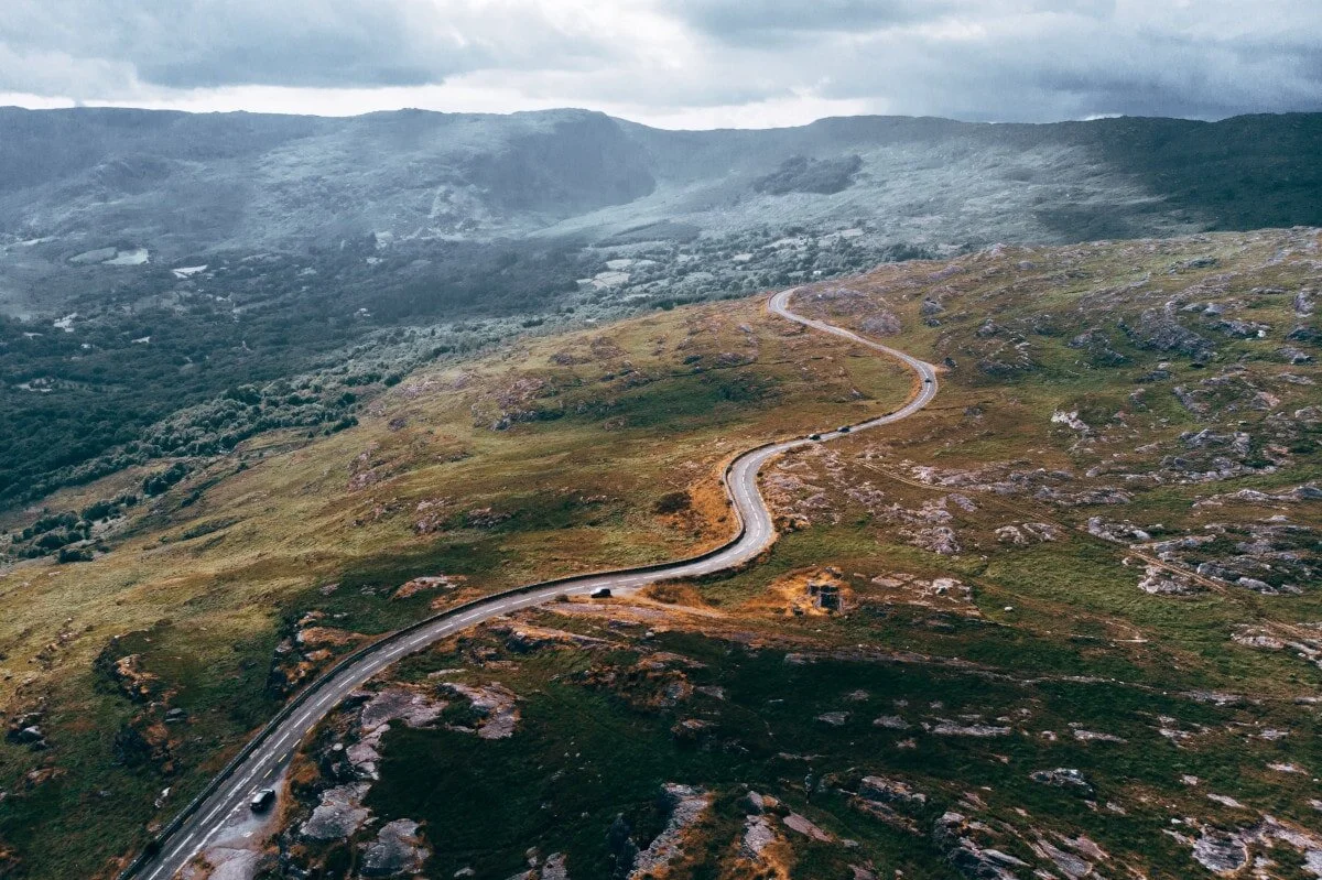 Funny quotes on road trips are often inspiring too- just like this picture of a stunning road curling, curving, and unfurling before you.