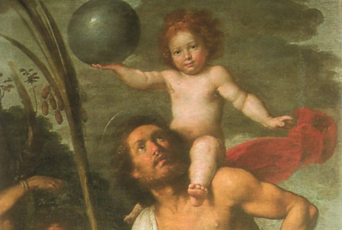 A centuries old depiction of St. Christopher, the patron saint travellers look to for guidance, carrying Christ (keep reading to find out how this part of the story comes about!)