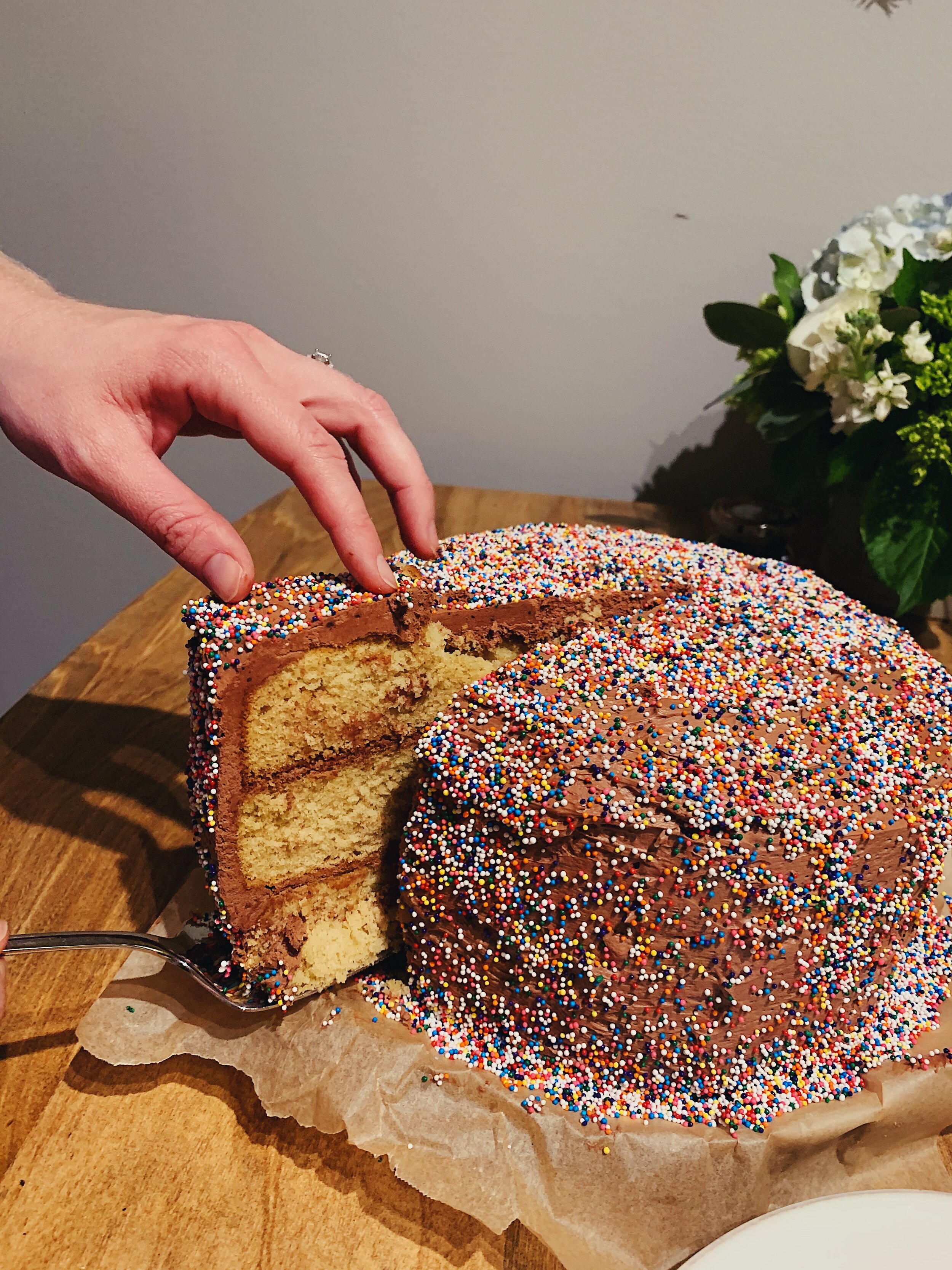 everyones-favorite-celebration-cake-alison-roman-slicing.jpg