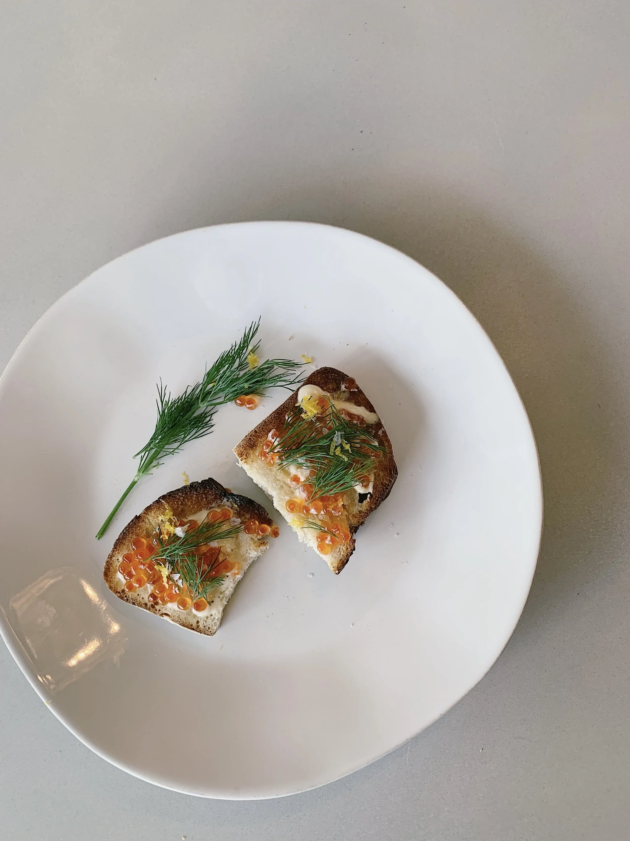 Trout Roe on Buttered Toast with Lemony Herbs &amp; Smoked Trout with Mustard and Apples by Alison Roman