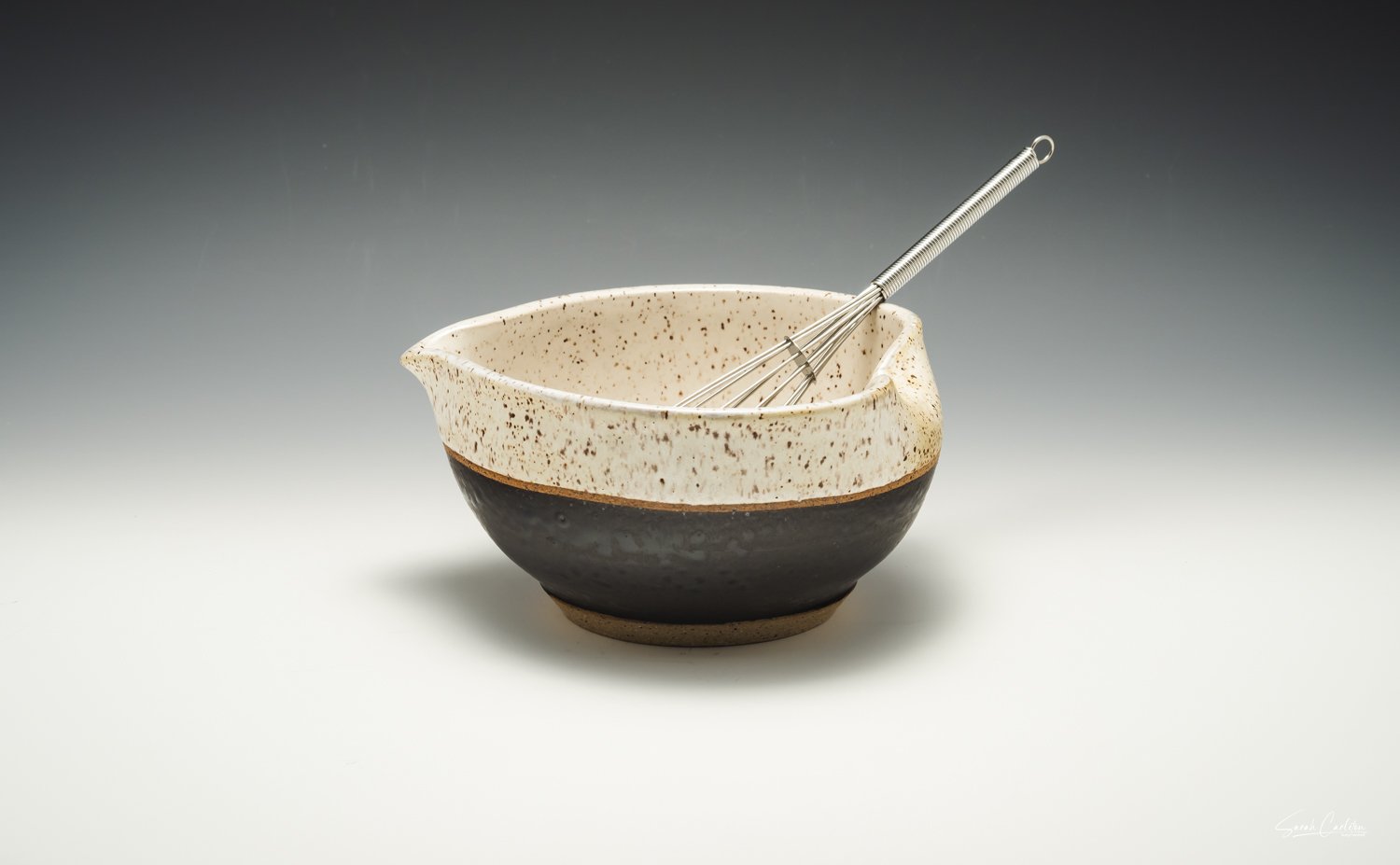 Mixing bowl with whisk.