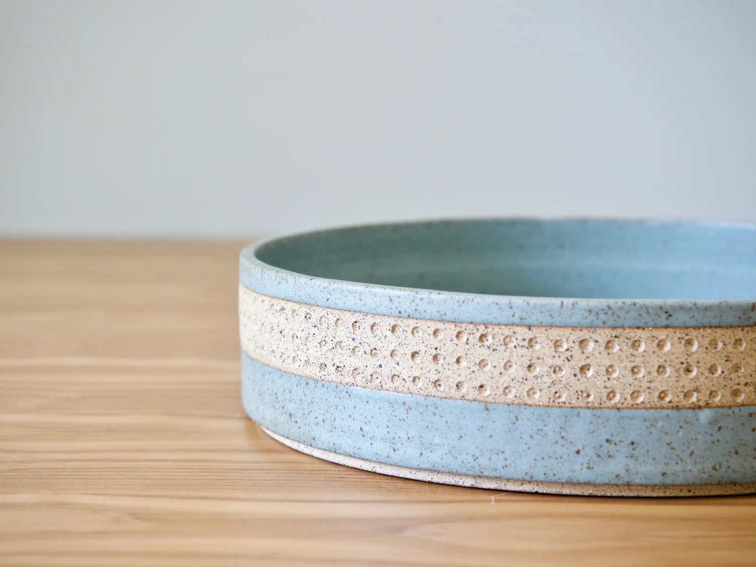Close-up up of straight-sided serving bowl in frost blue matte