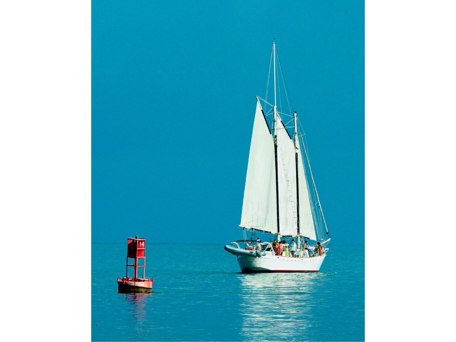 Sailboat sailing past 14