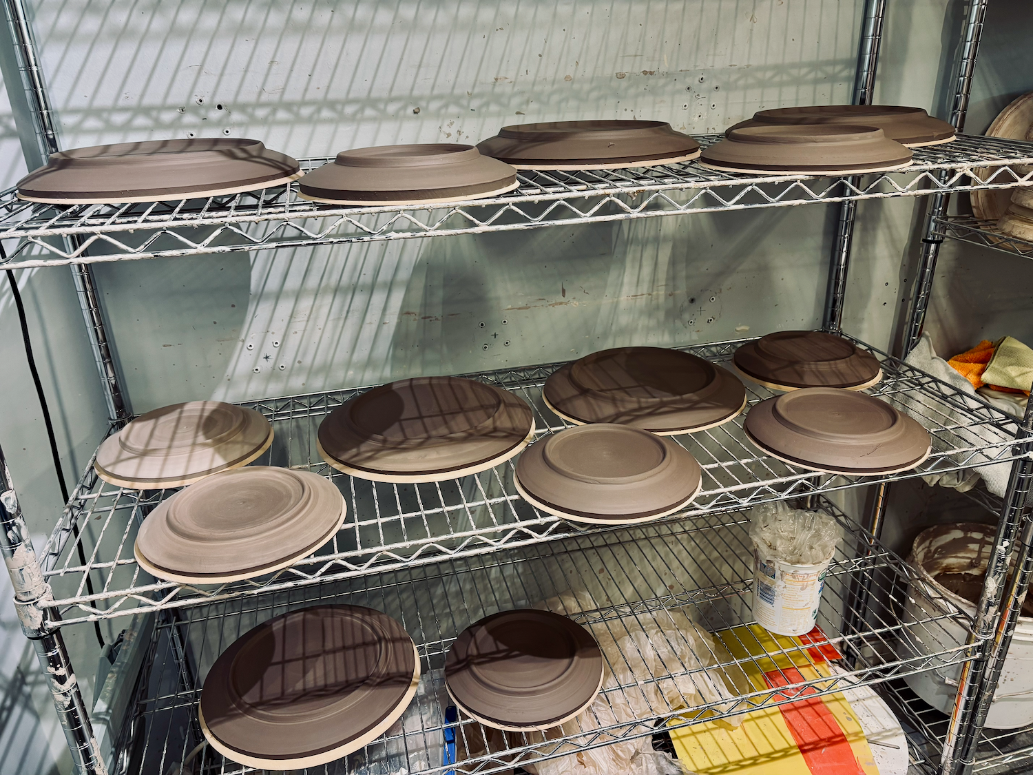 Plates on rack shelves.