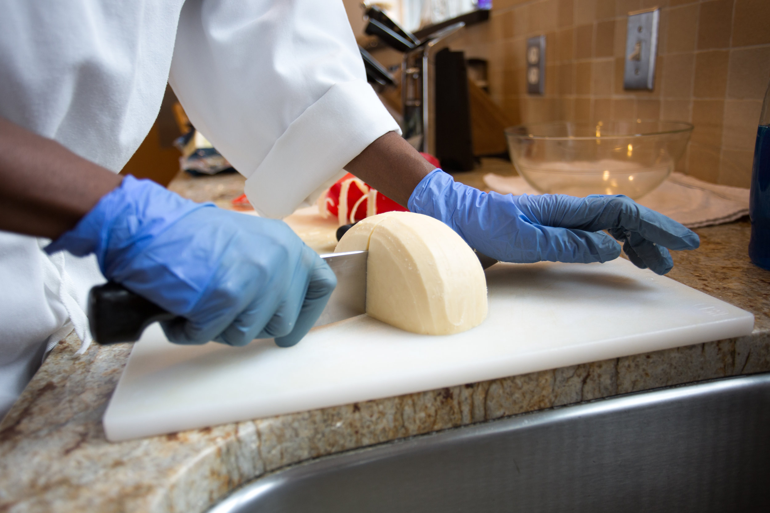  Sister Myriam unwraps gouda cheese in the monastery’s kitchen for Sunday’s spaghetti night March 11, 2019 in Crozet, Virginia. The sisters use their cheese for almost every meal and it never goes to waste. “How can you get sick of something that you