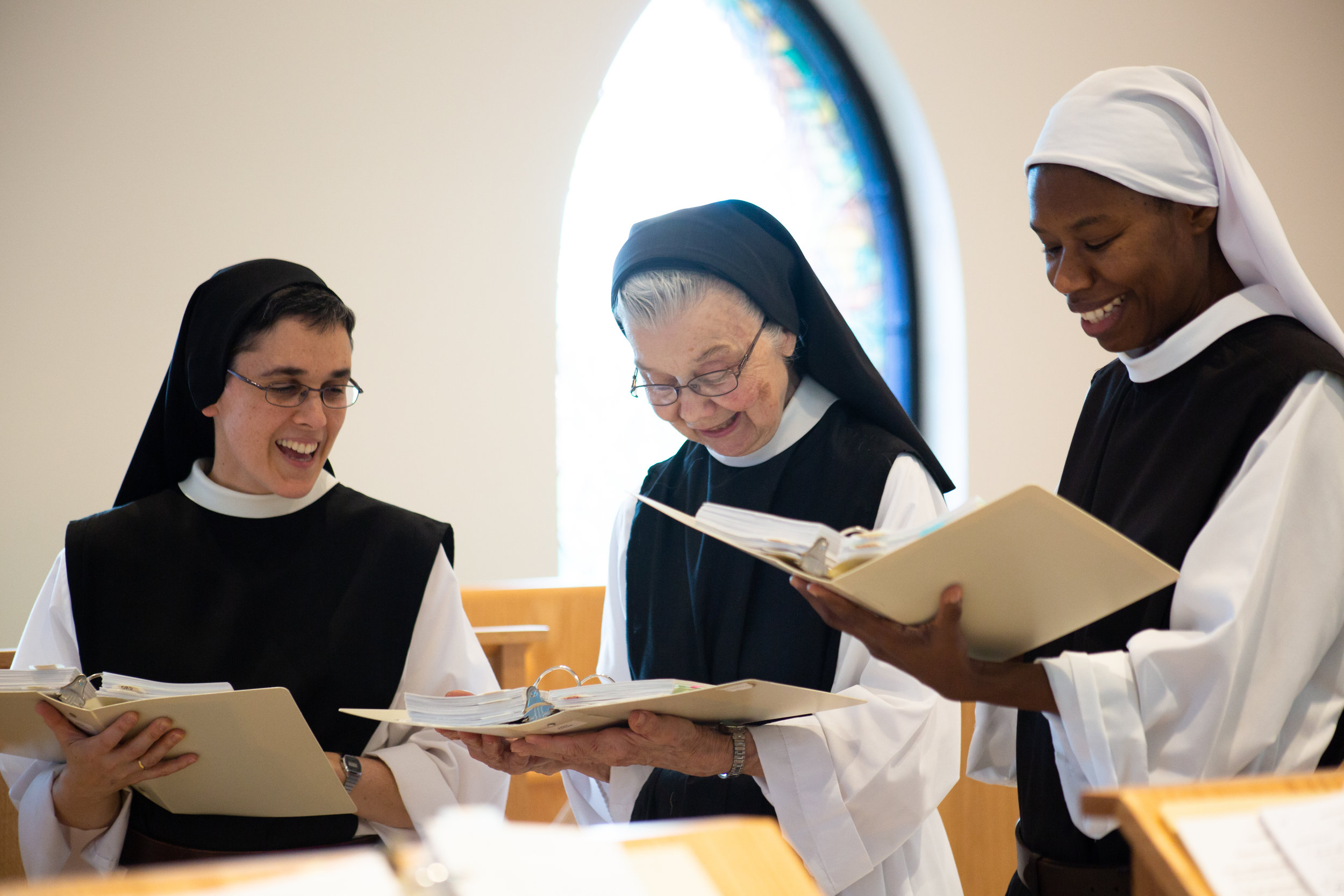  Sister Marie, Sister Barbara and Sister Myriam practice lyrics for their Palm Sunday Mass April 12, 2019 in Crozet, Virginia. The three have been practicing all week making sure they hit every note correctly and on key. “This is will be the last nig