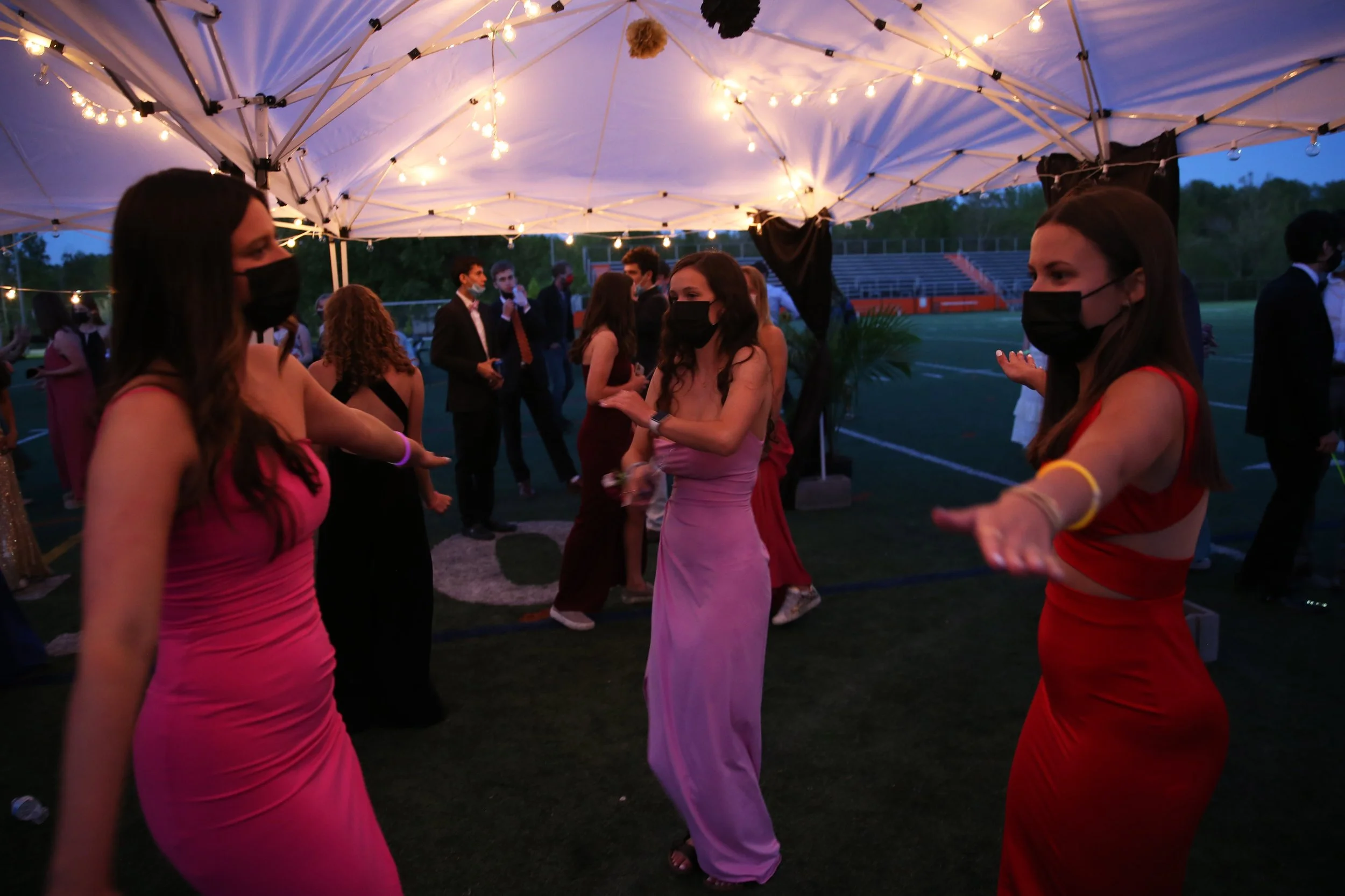  Students dance, while waving their arms to emphasize social distancing, Saturday, May, 1, 2021 on Charlottesville High School’s football field. CHS hosts an outdoor prom, featuring a dance floor, games and photo booth. Students donned their prom bes