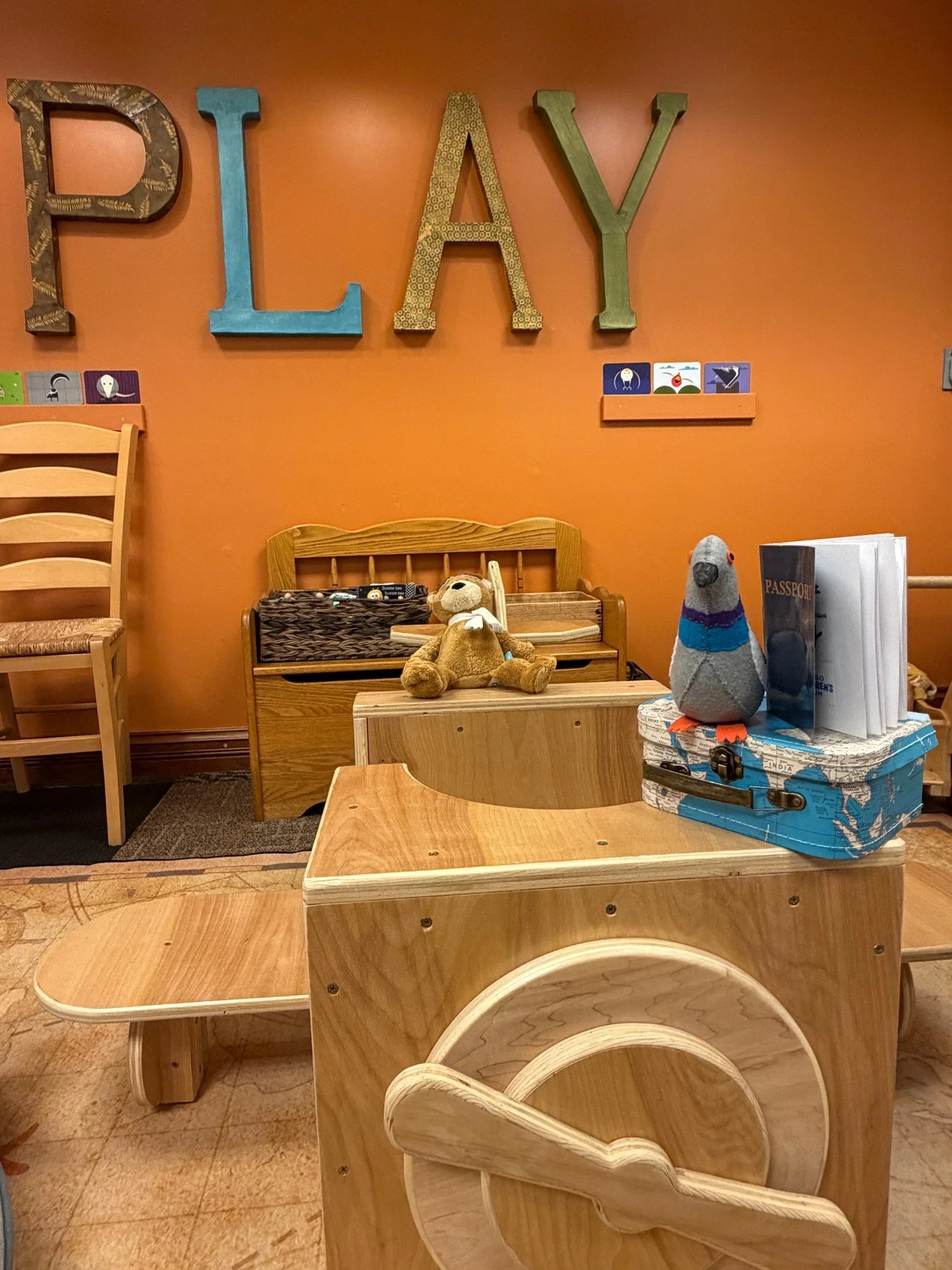 Earl grabbed his passport and flapped into Pritzker Playspace to see what our new program, Going Places: Paths, Routes &amp; Journeys, was all about. He hopped on a plane, took a ride on a boat, and took a reading break while getting a ride in the ca