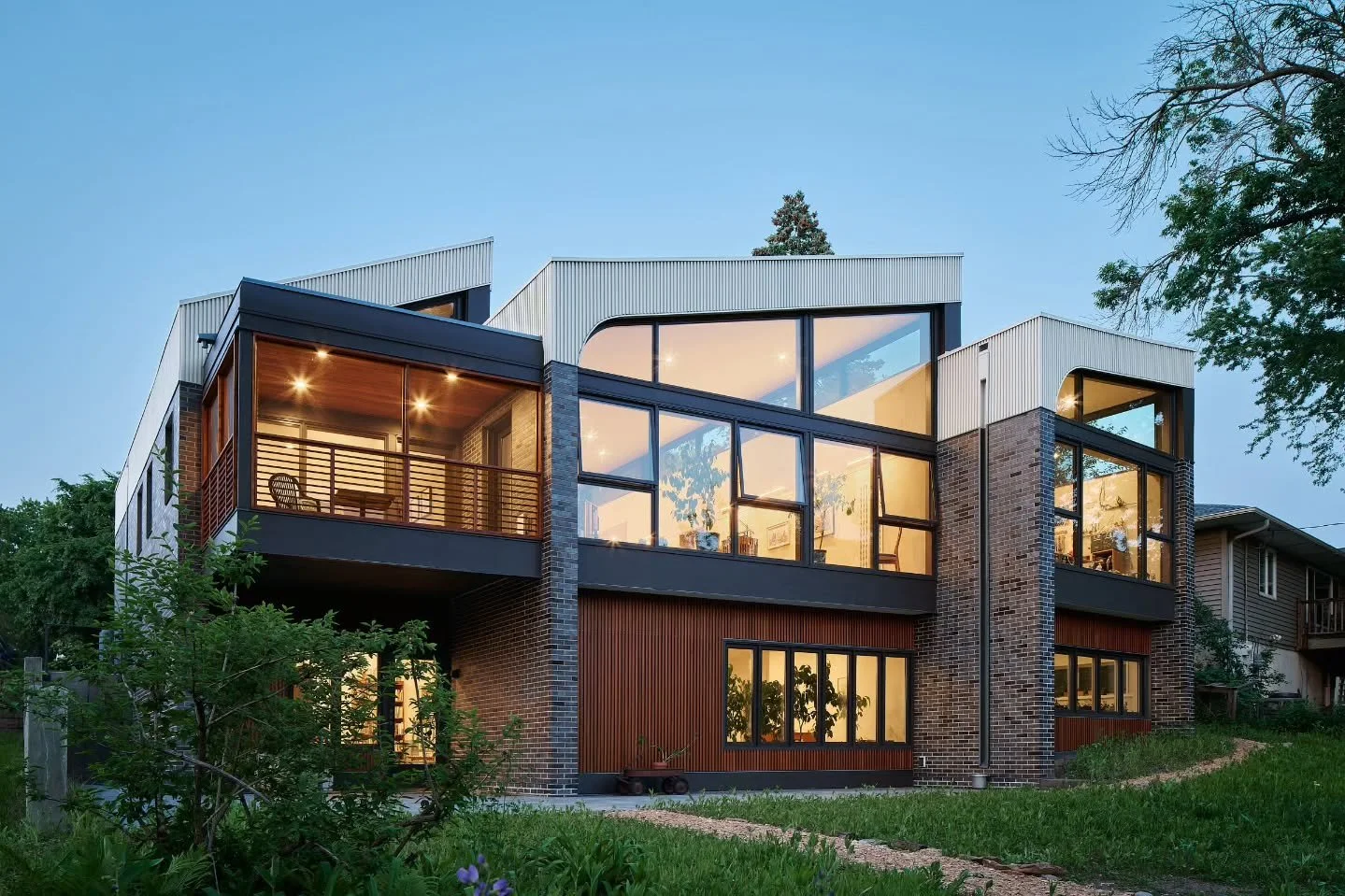 Introducing Crescendo in partnership with CityDeskStudio. This was a fantastic project with a stunning outcome. Backing up to Minnehaha Creek, this pie shaped lot allowed for a small subtle entry which expands to massive views out the back giving thi