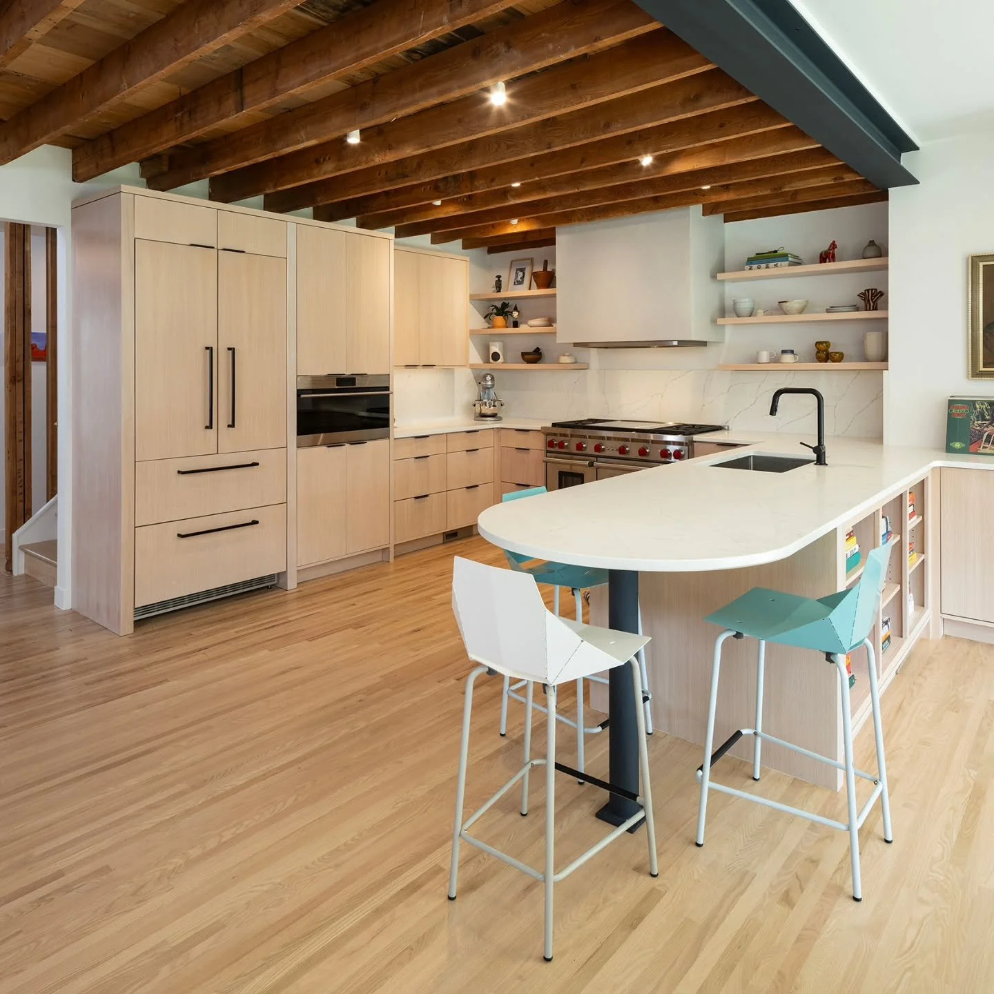 Old meets new. We added a 2nd story to this South Minneapolis house and re-located the kitchen. We set the 2nd floor trusses on top of the original attic framing to expose the original wood. The capabilities of clever design shines on this one.