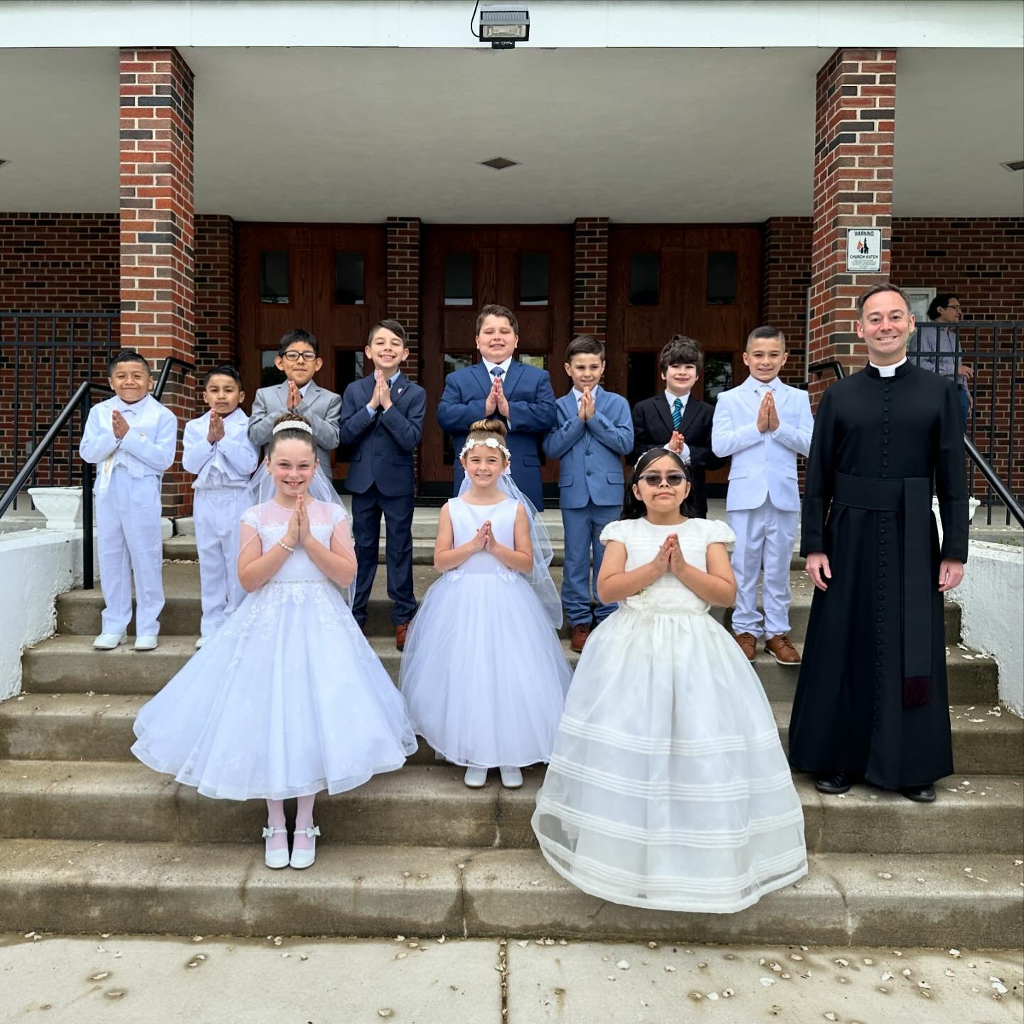 Congratulations and may God bless our First Communicants on this special day! May Jesus enter your hearts and always be your close friend! 

During Mass the children presented flowers to the Blessed Mother and crowned her. They were also enrolled in 