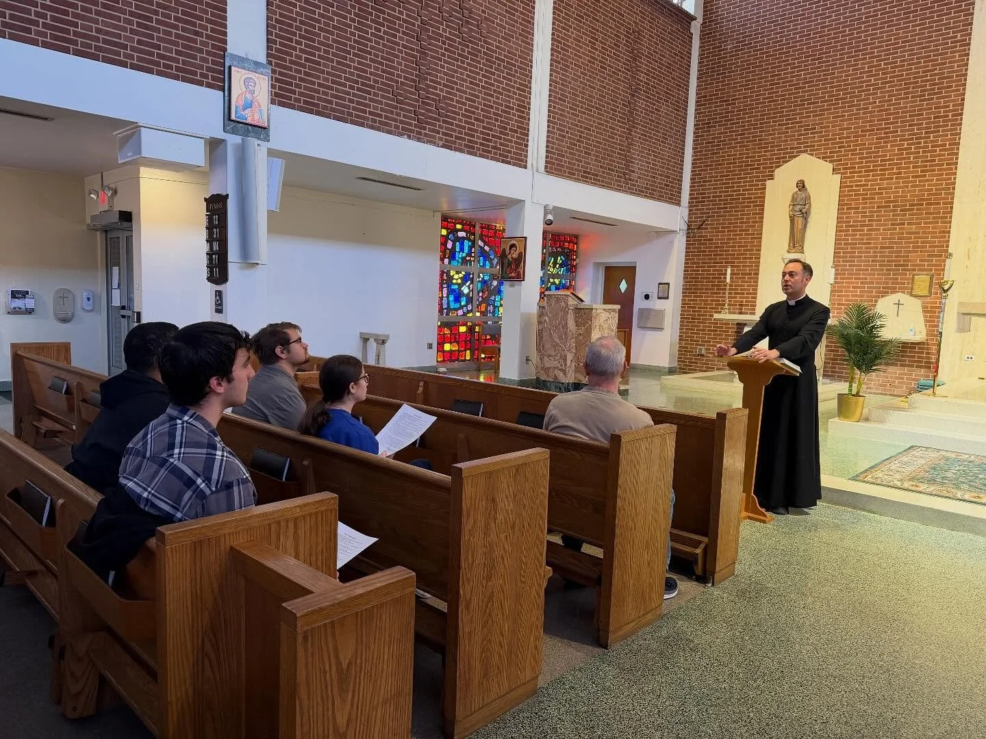 This morning Fr. Rossi trained &amp; installed four new student Lectors. We are blessed to have many students serving in our parish! Thank you to parishioner, John Capitanio for assisting with the training. 

May God bless our four new lectors in the
