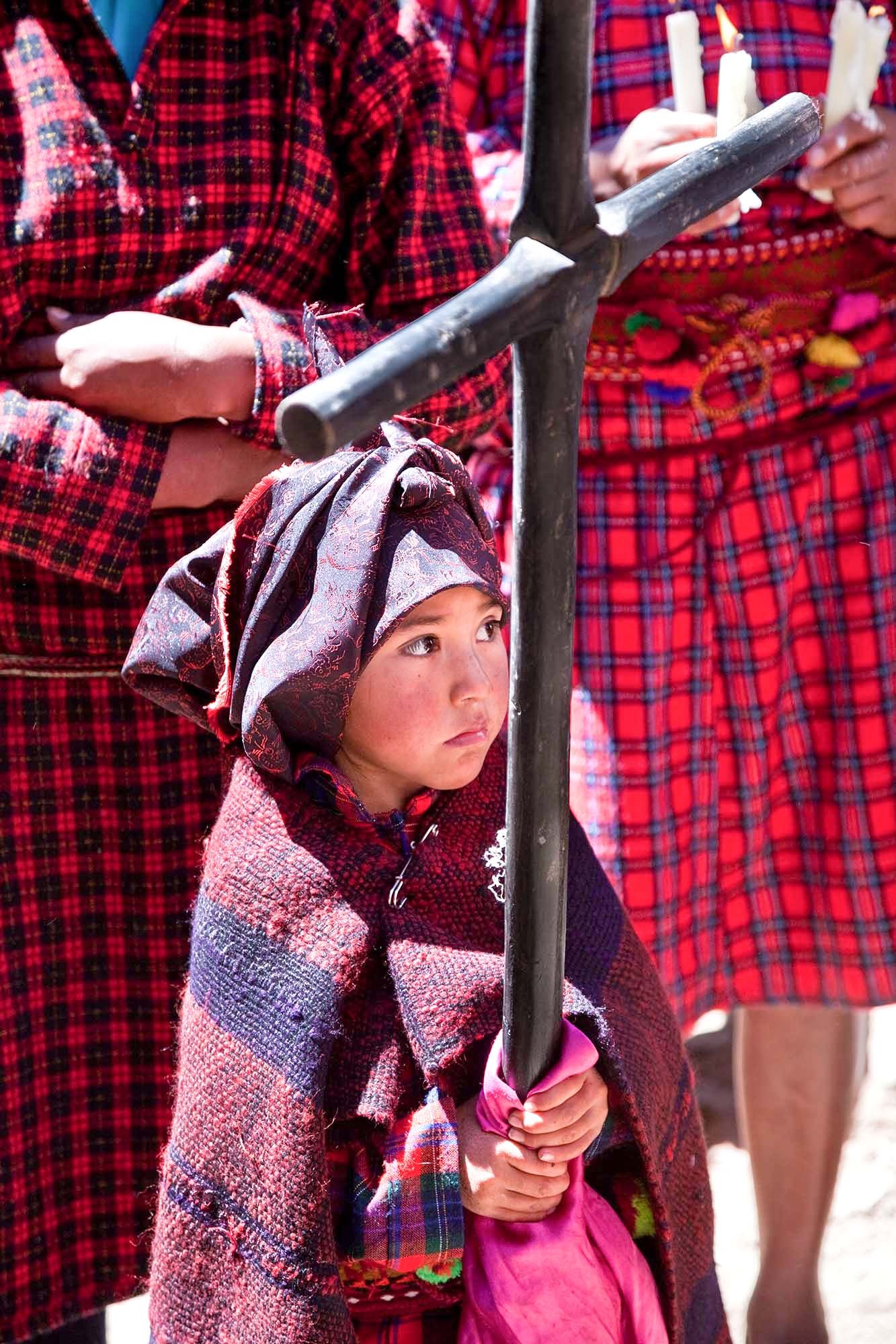  Saint Bartholomew procession.    The  kacxa  is a thick black or dark colored blanket with colored  stripes and fringes made of alpaca wool.  Women can’t survive without  this blanket.  It is used stay warm in the cold of the dawn when they go  to w