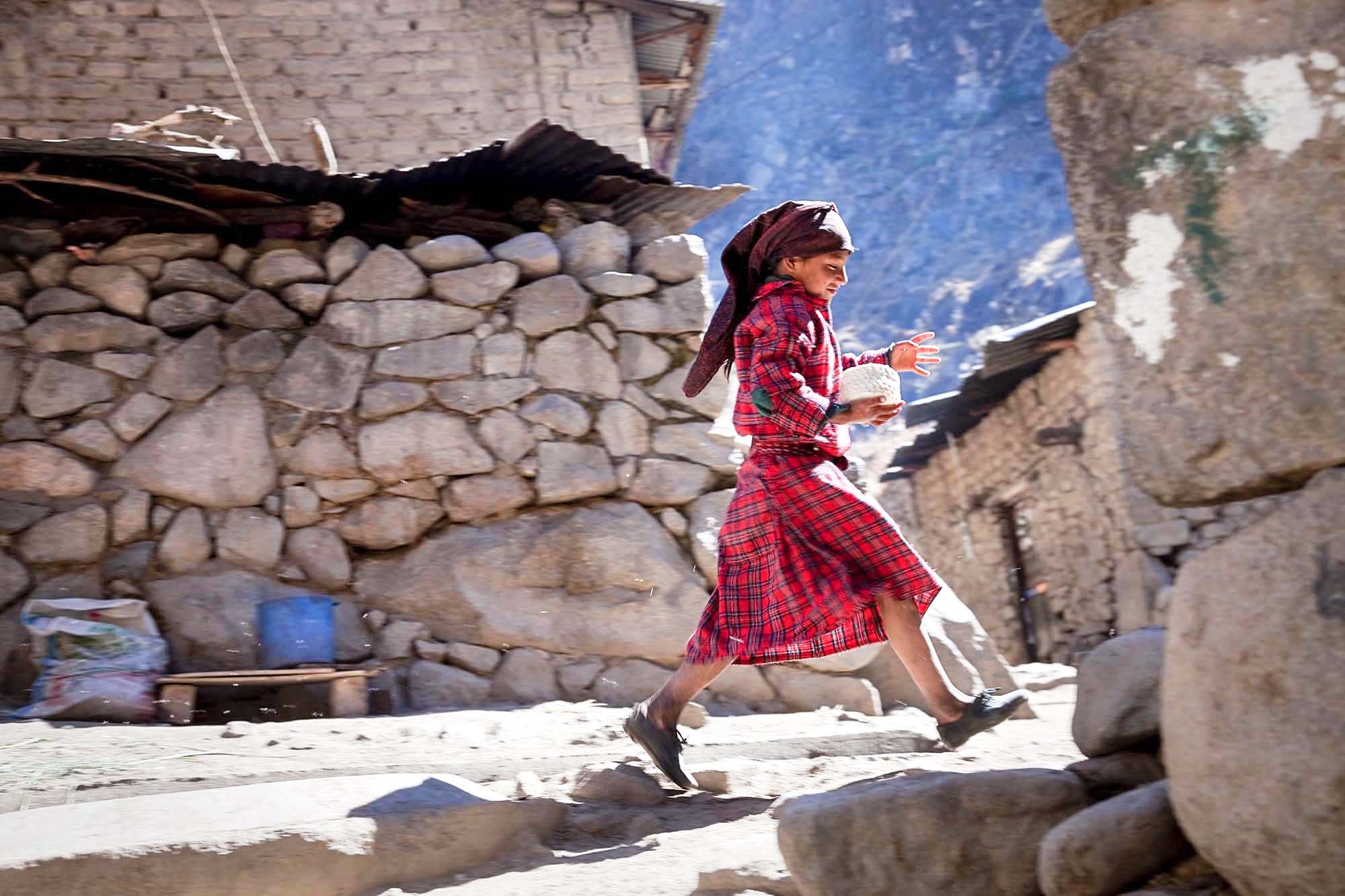  Evelyn  taking the cheese home.  Cheese is made on a daily basis.  Children  learn from a young age to milk the cows and make cheese.  The cheese is  kept for the months where the cows don't produce milk due to harsh  weather and lack of pasture to 