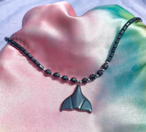 one of a kind hematite necklace shaped like a mermaid tail