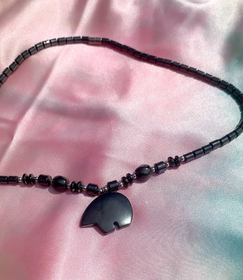 one of a kind hematite necklace shaped like a bear side profile