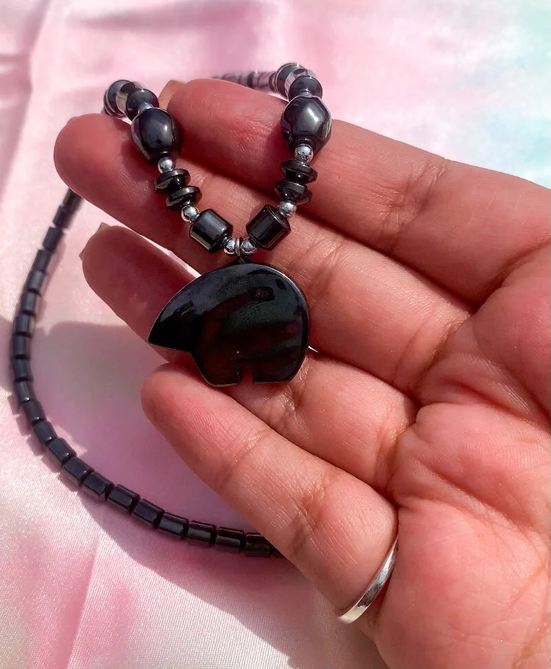 one of a kind hematite necklace shaped like a bear side profile close up