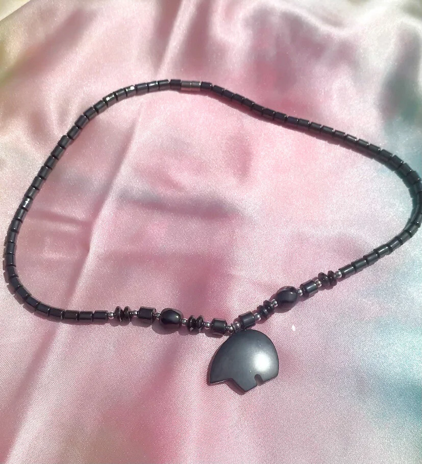 one of a kind hematite necklace shaped like a bear side profile