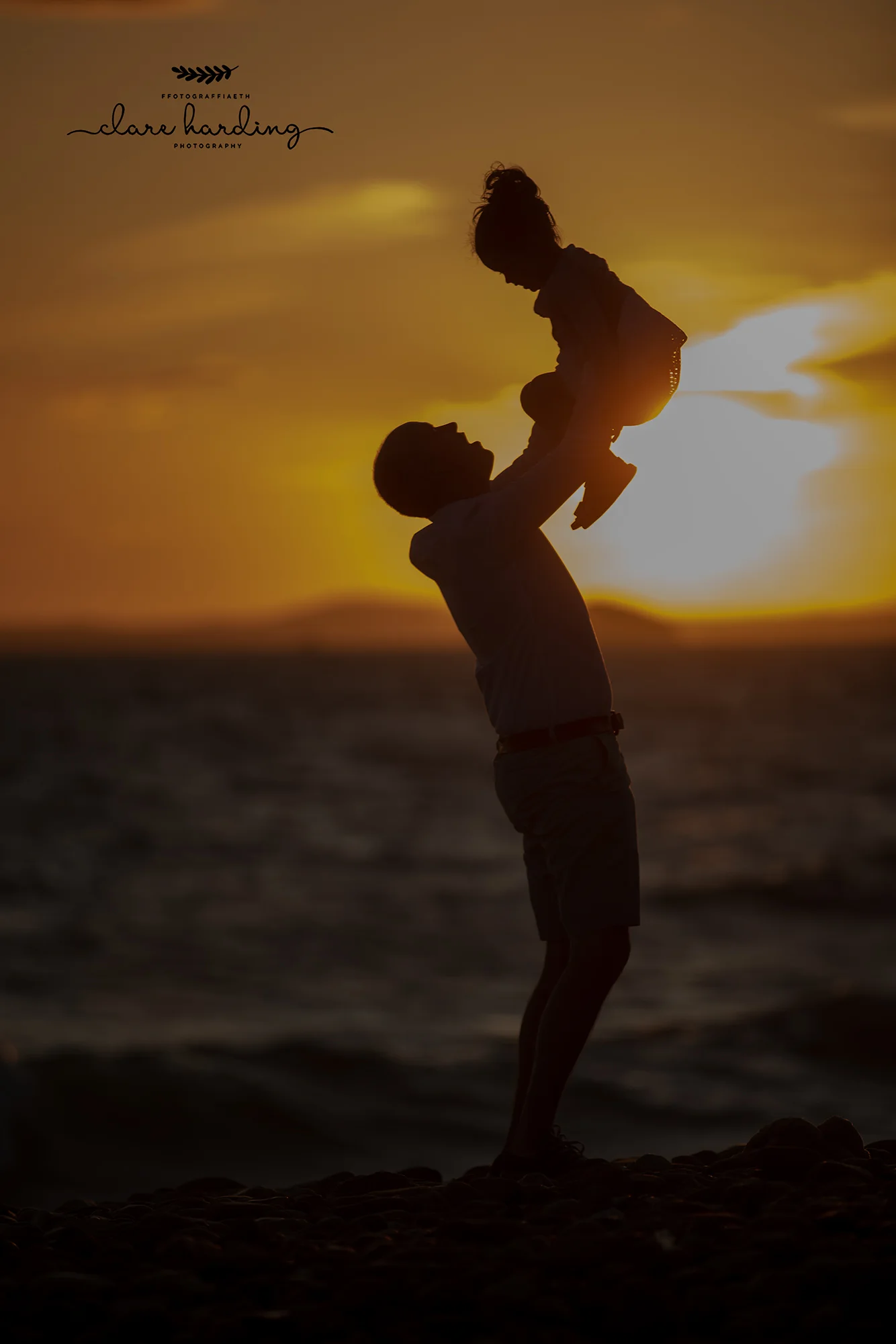 little girl and dad on the beach taken by south wales family photographer