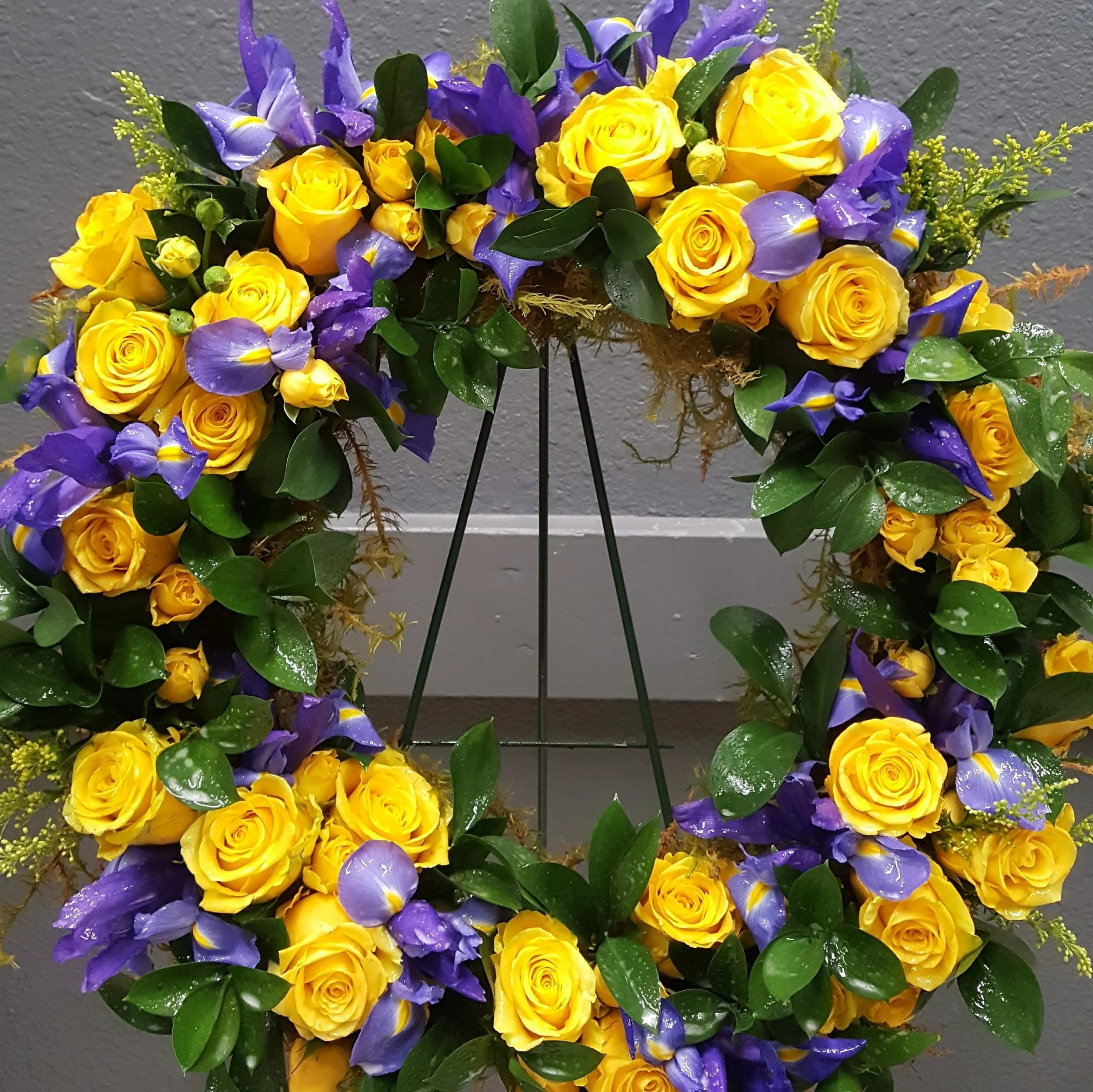 A memorial wreath custom designed for a Navy Veteran. Wreaths can be displayed on an easel, or laid at the grave site.