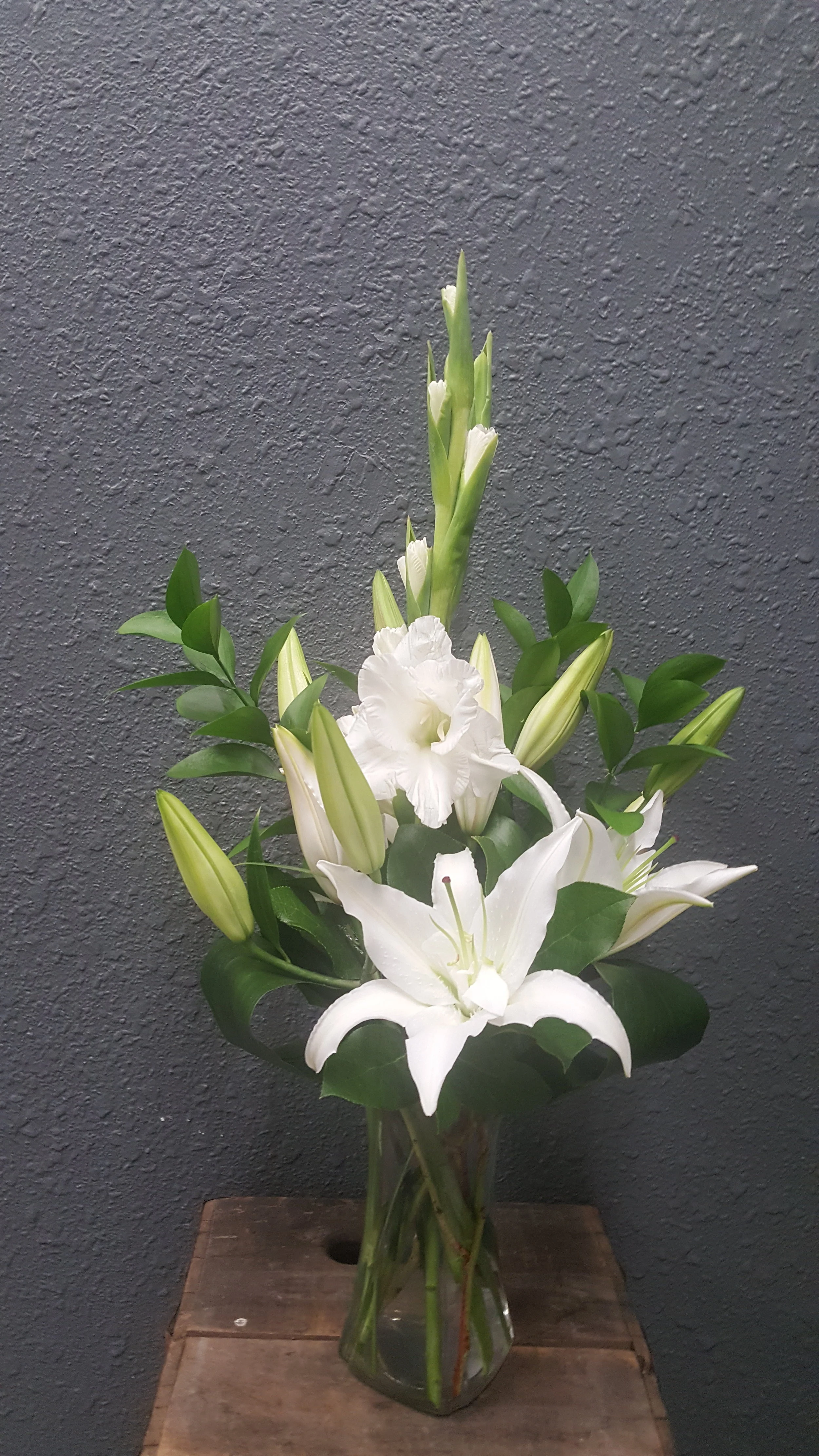 An all white and green vase arrangement. Peaceful and classic.