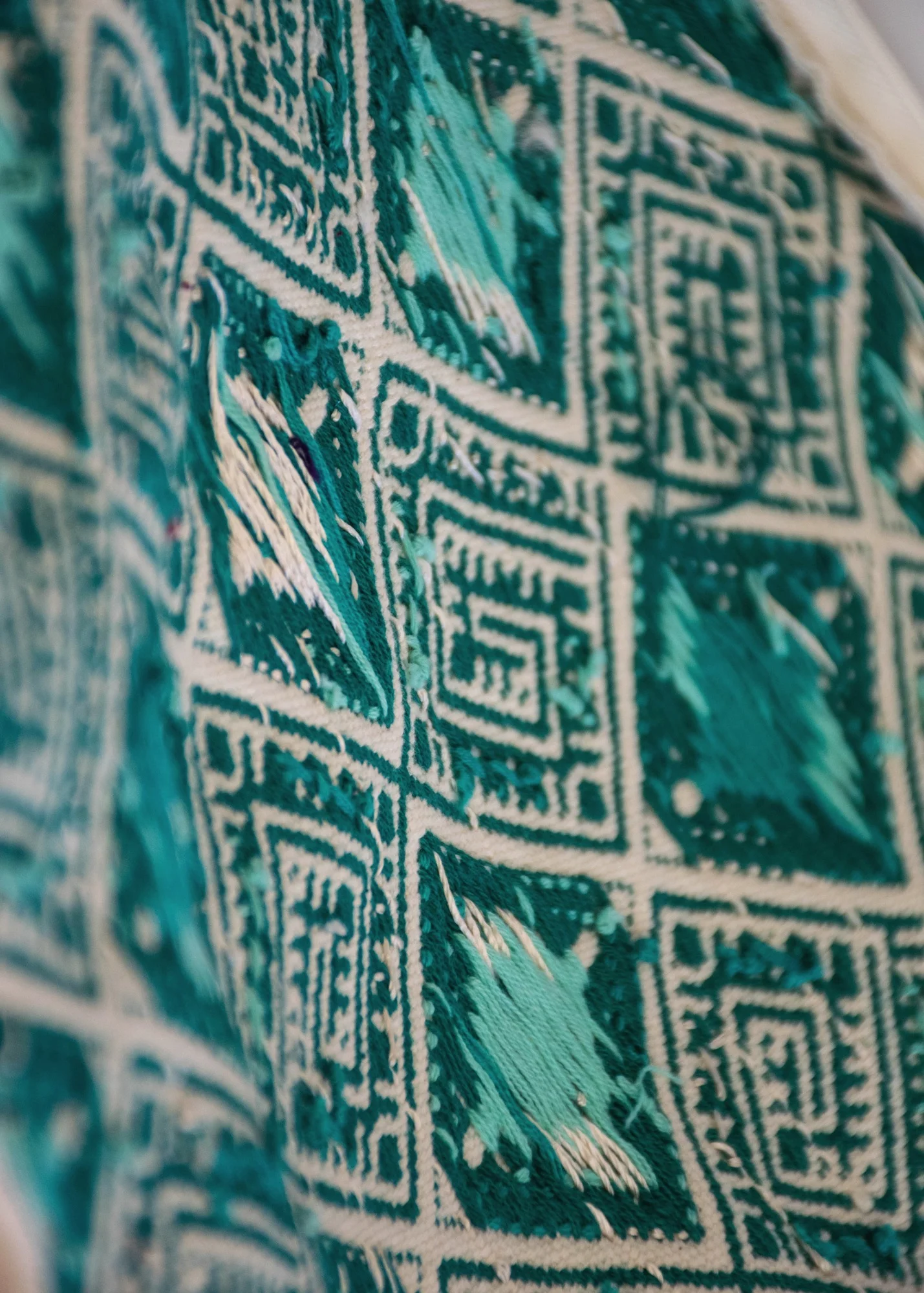 The back side of a brocaded design on a backstrap loom.